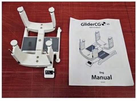 GliderCG device and instruction manual on a workbench