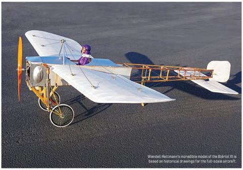 Electric model of a Blériot XI aircraft on a paved surface.