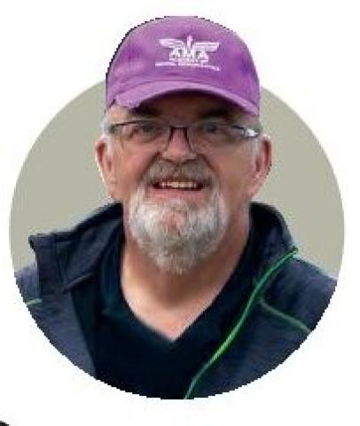 Portrait of Eric Williams wearing an AMA cap.