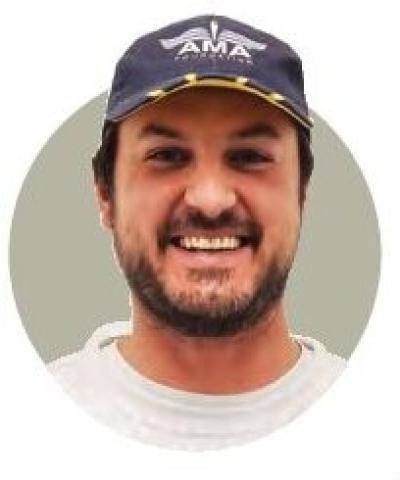 Circular portrait of Brandon Koch wearing an AMA cap.