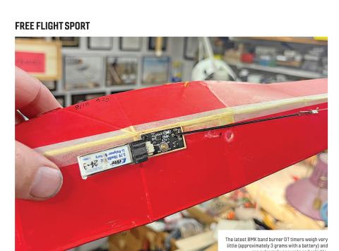 Close-up of a model wing with a BMK band-burner DT timer and battery installed