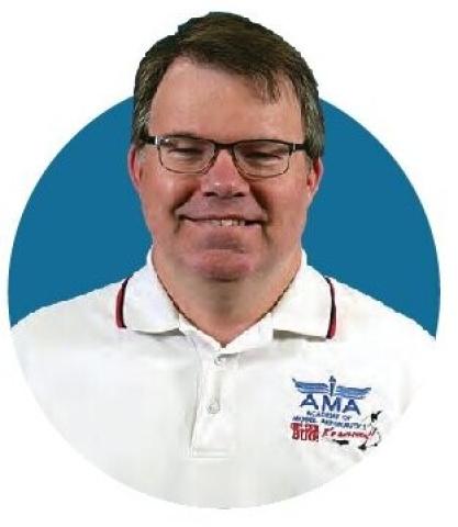 Portrait of Jay Smith wearing an AMA shirt