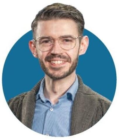 Portrait of Lucas Rodden in front of a blue circular background