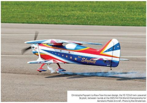 Colorful Skybolt aerobatic model aircraft flying low over a runway.
