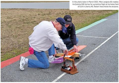 Mike Langlois and Robert Vess prepare a Quickie 500 Vortex for a practice flight beside a pylon racing course.