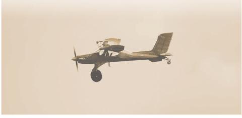 Photograph of a model airplane in flight