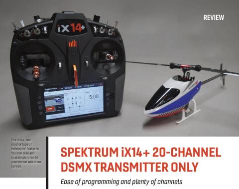 Spektrum iX14+ transmitter beside a model helicopter