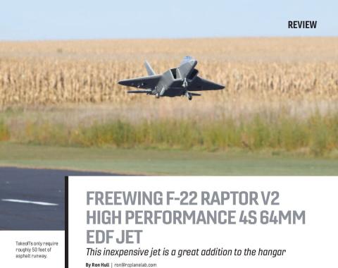 Freewing F-22 Raptor flying low over a runway and field